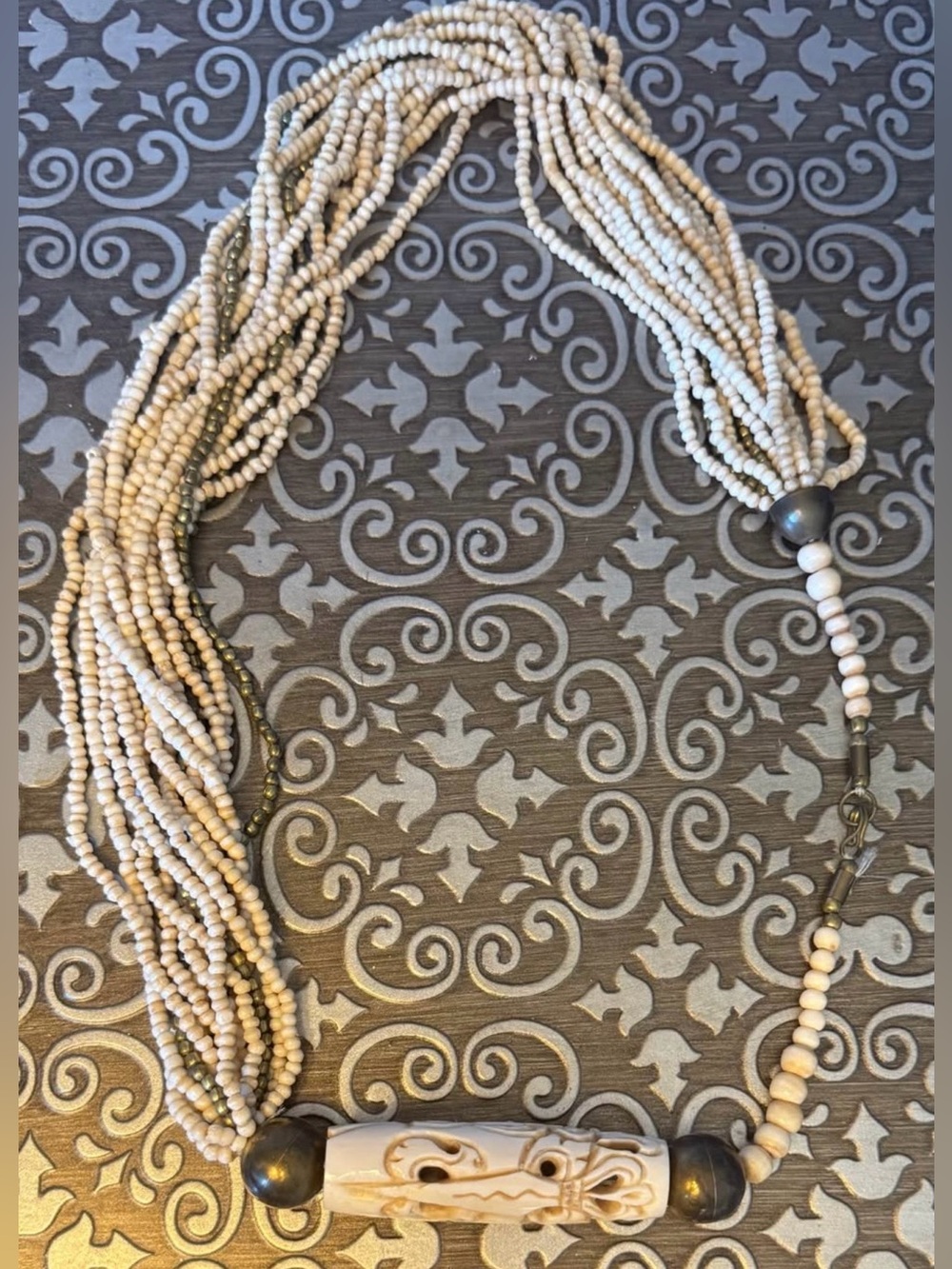 Handcrafted Cream Beaded Multi-Strand Necklace with Carved Pendant
